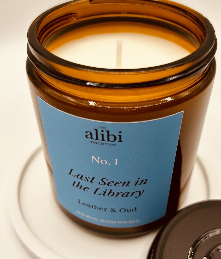 Last Seen in the Library candle, lid off showing the wax and wick