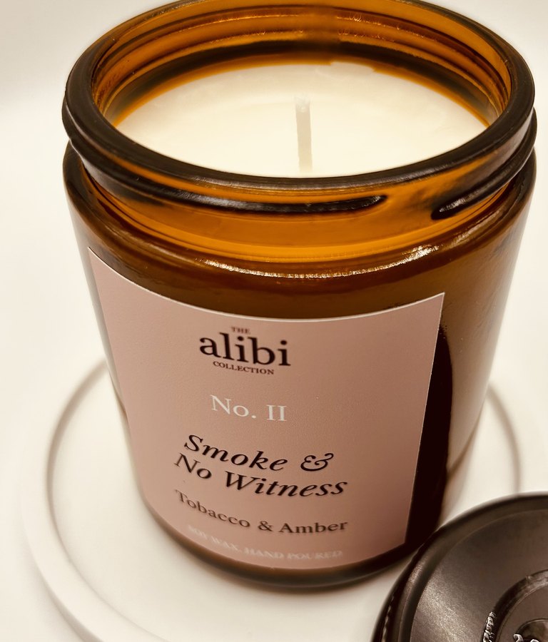 Smoke & No Witness candle, lid off showing the wax and wick