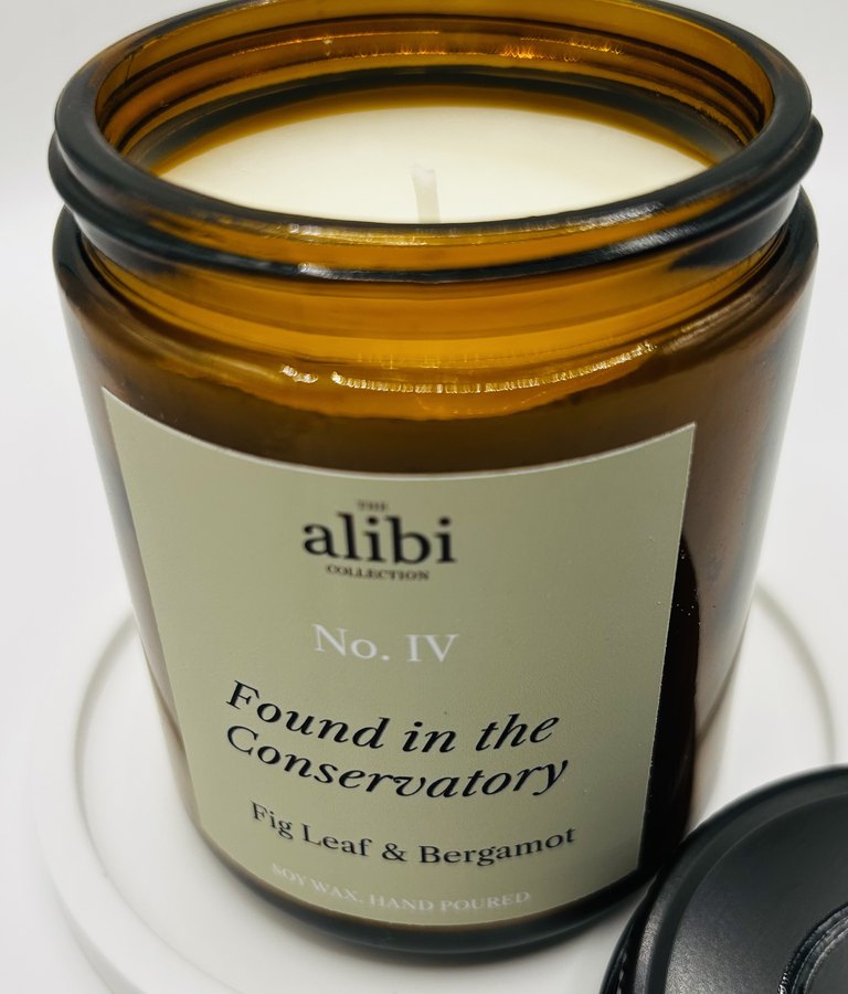 Found in the Conservatory candle, lid off showing the wax and wick