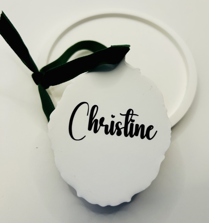 A diffuser personalised on the reverse with a name in script, finished with a green velvet ribbon