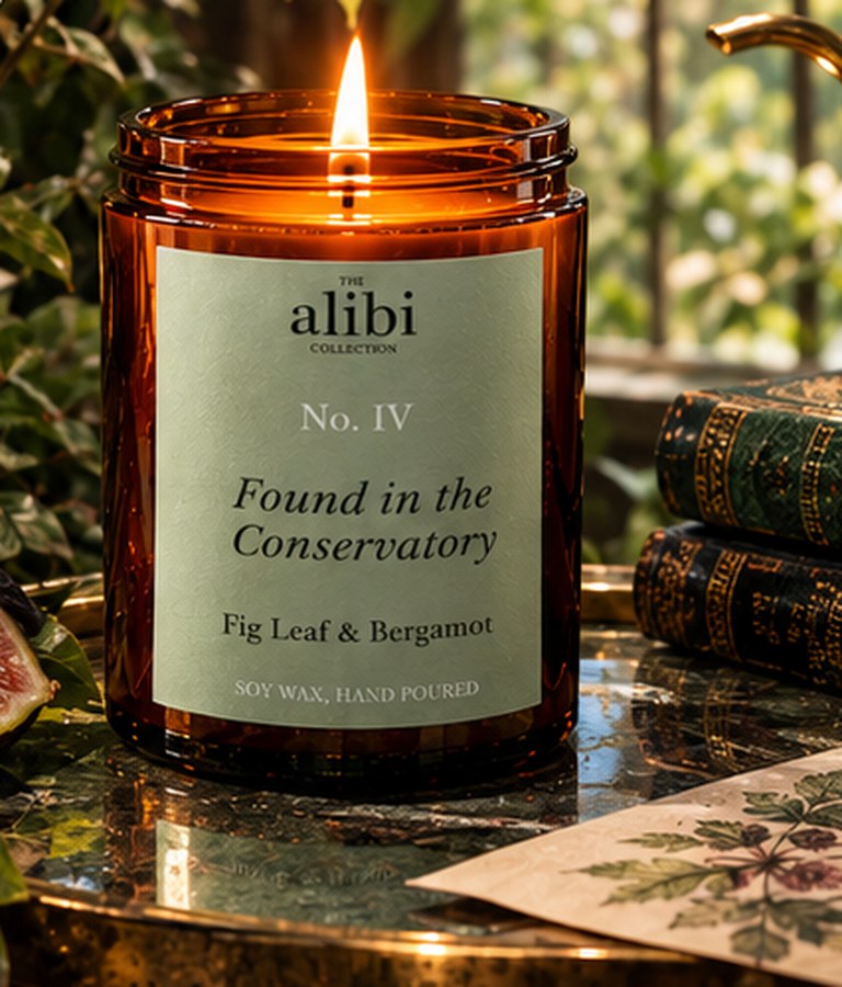 Found in the Conservatory candle burning among terracotta pots and ivy by a rain-streaked window